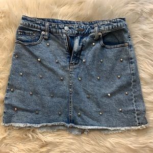 Embellished jean skirt. Size 10.